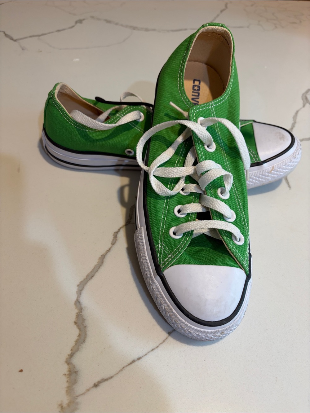 Green low top Converse sneakers